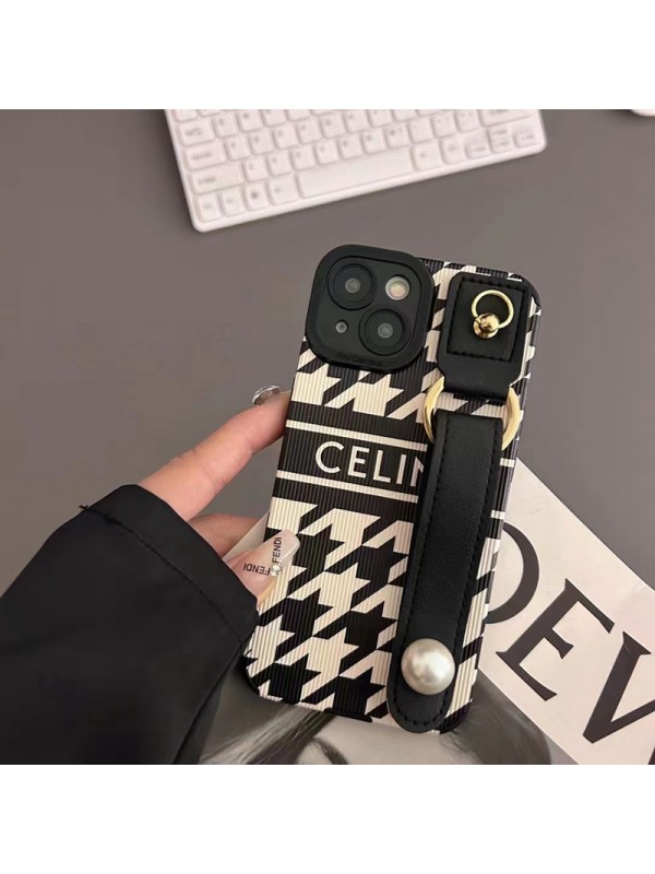 CELINE ブランド セリーヌ iphone14/14 pro/14 pro maxケース 韓国風 ハンドバンド付 モノグラム レザー製 ジャケット型 黒白色 リング付 アイフォン14プロ マックス/14プロ/14/13/12/11/x/xs/xrカバー 大人気 メンズ レディース