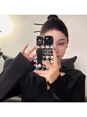 CELINE ブランド セリーヌ iphone14/14 pro/14 pro maxケース 韓国風 ハンドバンド付 モノグラム レザー製 ジャケット型 黒白色 リング付 アイフォン14プロ マックス/14プロ/14/13/12/11/x/xs/xrカバー 大人気 メンズ レディース