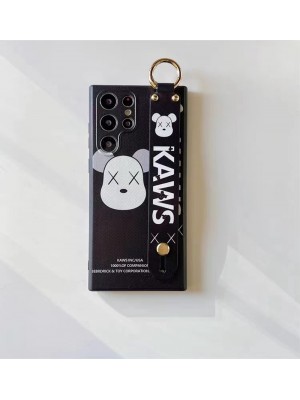 Kaws ブランド Galaxy S23/S23+/S23 Plus/S23 Ultraケース 熊柄 カウズ おしゃれ リング付き ジャケット型 ハンドバンド付き スタンド機能 モノグラム 韓国風 ギャラクシーs23/s23プラス/s23ウルトラ/s22/s21カバー 耐衝撃 ファッション メンズ レディーズ