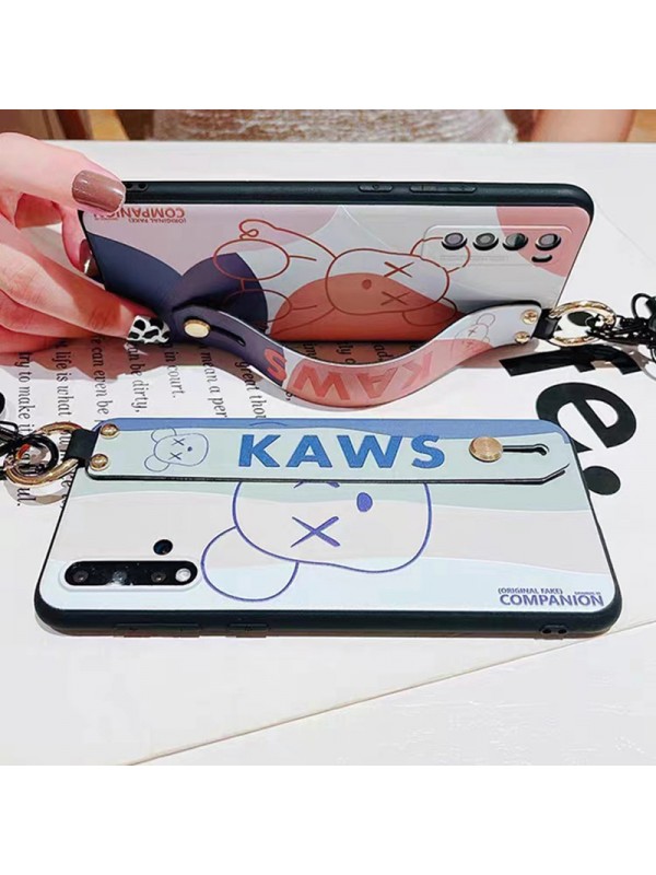 KAWS ブランド Galaxy S23/S23+/S23 Plus/S23 Ultra/A54 5Gケース カウズ 韓国風 ストラップ付き 熊柄 リング付き ハンドバンド付き スタンド機能 モノグラム ジャケット型 耐衝撃 ギャラクシーs23/s23プラス/s23ウルトラ/s22/s21/a54カバー ファッション メンズ レディーズ